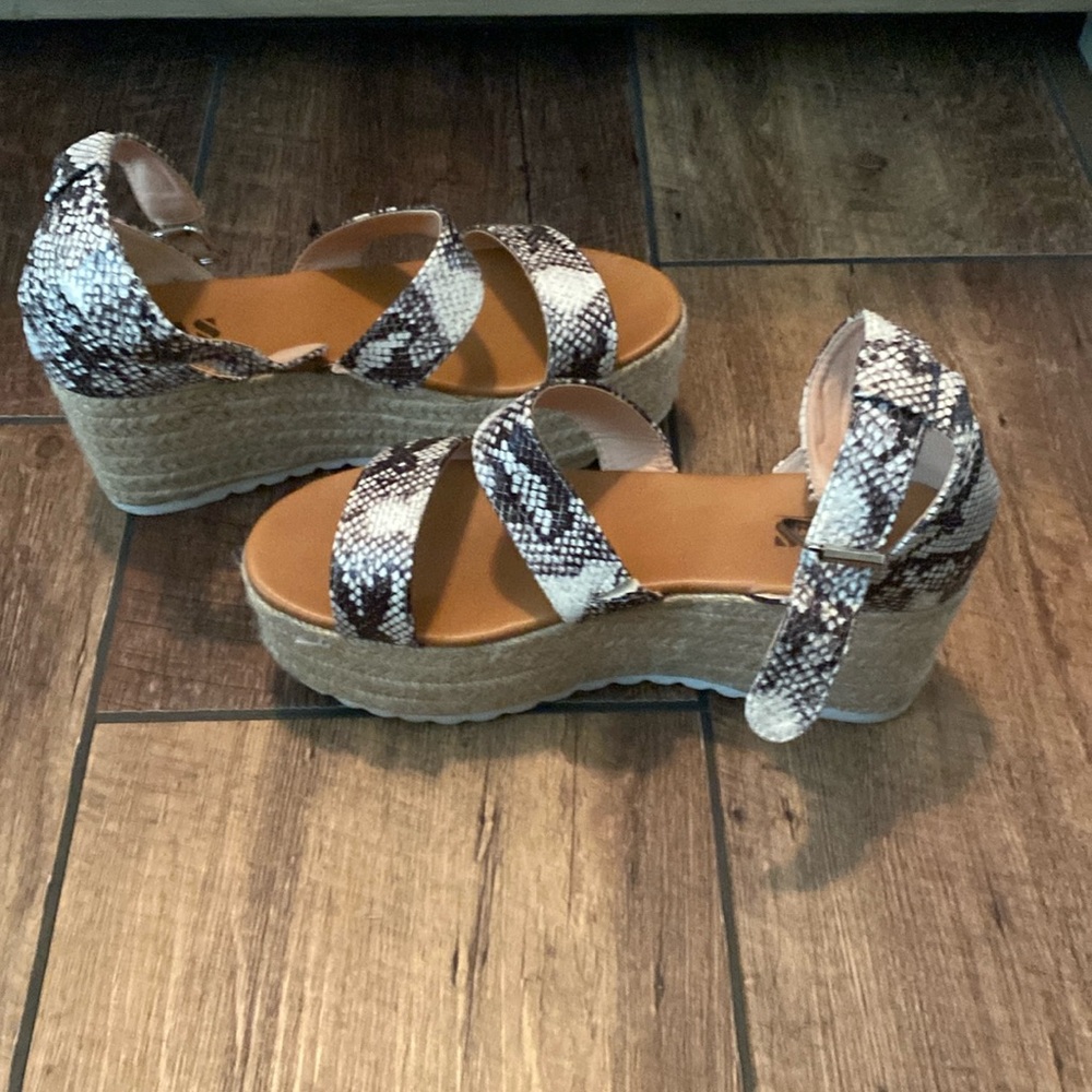 AMS wedges. Like new. First strap has stretchy material for easy fitting.